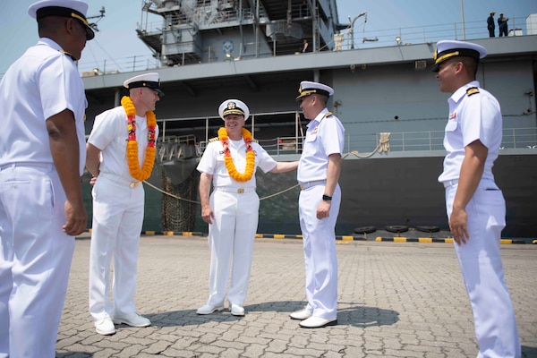 U.S. Navy Capt. Louis F. Catalina, commanding officer, U.S. 7th Fleet flagship USS Blue Ridge (LCC 19), center, is greeted by Capt. Kittipan Chaisiridham, commanding officer, HTMS Similan (871), and other Royal Thai Navy officers during an arrival ceremony in Laem Chabang, Thailand, March 26, 2026.
