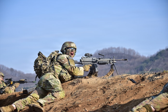 U.S. Army Pvt. Troy Odekirk, an infantryman assigned to 11th Airborne Division, calls for more ammo during Combined Arms Live-Fire Exercise (CALFEX) at Rodriguez Live Fire Complex, South Korea, Mar. 23, 2026.