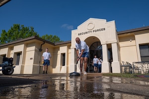 U.S. Air Force Chief Master Sgt. Eric Adams, 42d Security Forces Squadron senior enlisted leader, pressure washes the 42d SFS front entrance during the wing’s Base Beautification Day at Maxwell Air Force Base, Alabama, March 26, 2026.