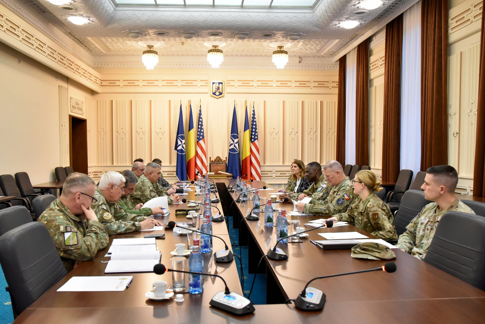 people sitting around a table in a conference room.