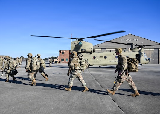 U.S. Airmen assigned to the 165th Security Forces Squadron, 165th Airlift Wing, Georgia Air National Guard, hot load onto a CH-47 Chinook at the Savannah Air National Guard Base, Georgia, Feb. 6, 2026. This training was part of a wing-wide employment exercise focused on validating 165th Airmen’s readiness to rapidly mobilize and sustain operations in a contested, deployed environment. (U.S. Air National Guard photo by Master Sgt. Morgan R. Whitehouse)