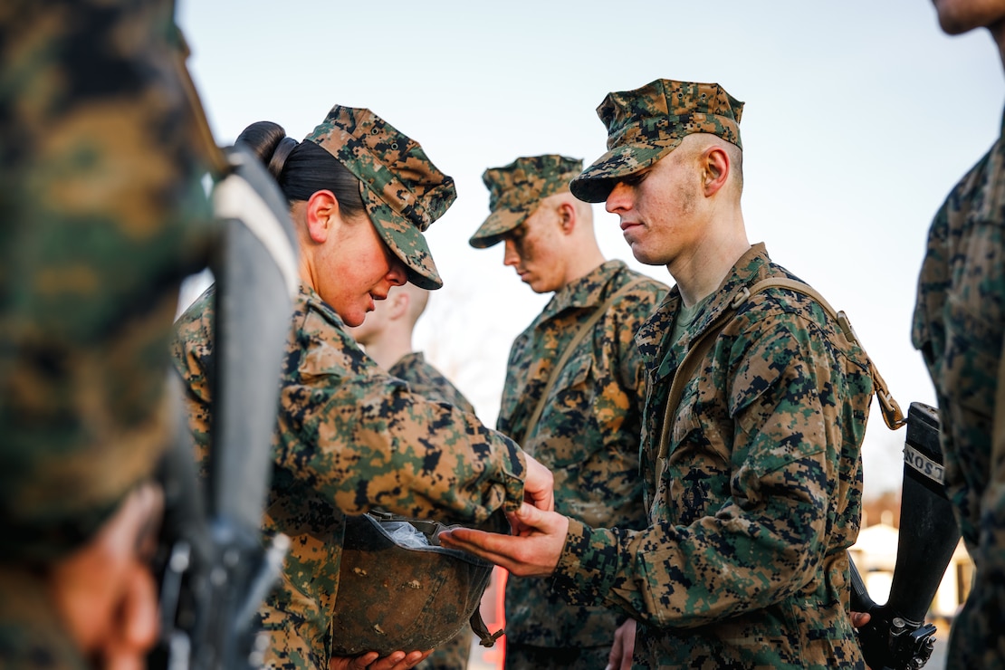 U.S. Marine Corps officer candidates with Officer Candidates Course 251, Company A, Officer Candidates School, receive the Eagle, Globe, and Anchor at Marine Corps Base Quantico, Virginia, March 13, 2026. Candidates receive their EGA after completing the Forge, which is the culminating event at OCS that tests candidates’ endurance, leadership and resilience under pressure during day and night events. (U.S. Marine Corps photo by Cpl. Joshua Barker)