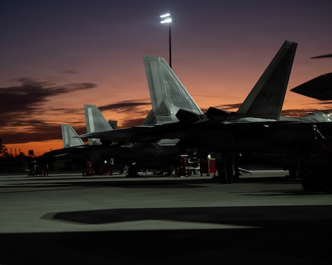 U.S. Air Force F-22 Raptor aircraft assigned to the 1st Fighter Wing, Joint Base Langley-Eustis, Virginia, sit on the flight line of the Savannah Combat Readiness Training Center (CRTC) during exercise Sentry South 26.1 at the Savannah (ANG) Base, Georgia, Jan. 21, 2026. Sentry South 26.1 in Savannah is an ANG-led counterair exercise held at the Savannah CRTC, also known as the Air Dominance Center, that trains hundreds of participants annually in offensive and defensive counterair missions with 4th- and 5th-generation aircraft to enhance combat readiness and joint integration. (U.S. Air National Guard photo by Staff Sgt. Josiah Meece).