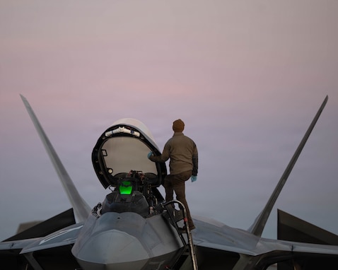 A U.S. Air Force maintainer with 1st Fighter Wing, Joint Base Langley-Eustis, Virginia, prepares an F-22 Raptor aircraft at the Savannah Combat Readiness Training Center (CRTC) during exercise Sentry South 26.1 at the Savannah Air National Guard (ANG) Base, Georgia, Jan. 21, 2026. Sentry South 26.1 in Savannah is an ANG-led counterair exercise held at the Savannah CRTC, also known as the Air Dominance Center, that trains hundreds of participants annually in offensive and defensive counterair missions with 4th- and 5th-generation aircraft to enhance combat readiness and joint integration. (U.S. Air National Guard photo by Staff Sgt. Josiah Meece).