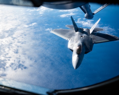 A U.S. Air Force F-22 Raptor aircraft assigned to the 1st Fighter Wing, Joint Base Langley-Eustis, Virginia, approaches the boom of a KC-135 Stratotanker aircraft assigned to the 126th Air Refueling Wing, Illinois Air National Guard (ANG), as it conducts air refueling operations over the coast of Georgia during exercise Sentry South 26.1 at the Savannah Combat Readiness Training Center (CRTC), Savannah ANG Base, Georgia, Jan. 28, 2026. Sentry South 26.1 in Savannah is an ANG-led counterair exercise held at the Savannah CRTC, also known as the Air Dominance Center, that trains hundreds of participants annually in offensive and defensive counterair missions with 4th- and 5th-generation aircraft to enhance combat readiness and joint integration. (U.S. Air National Guard photo by Staff Sgt. Josiah Meece).