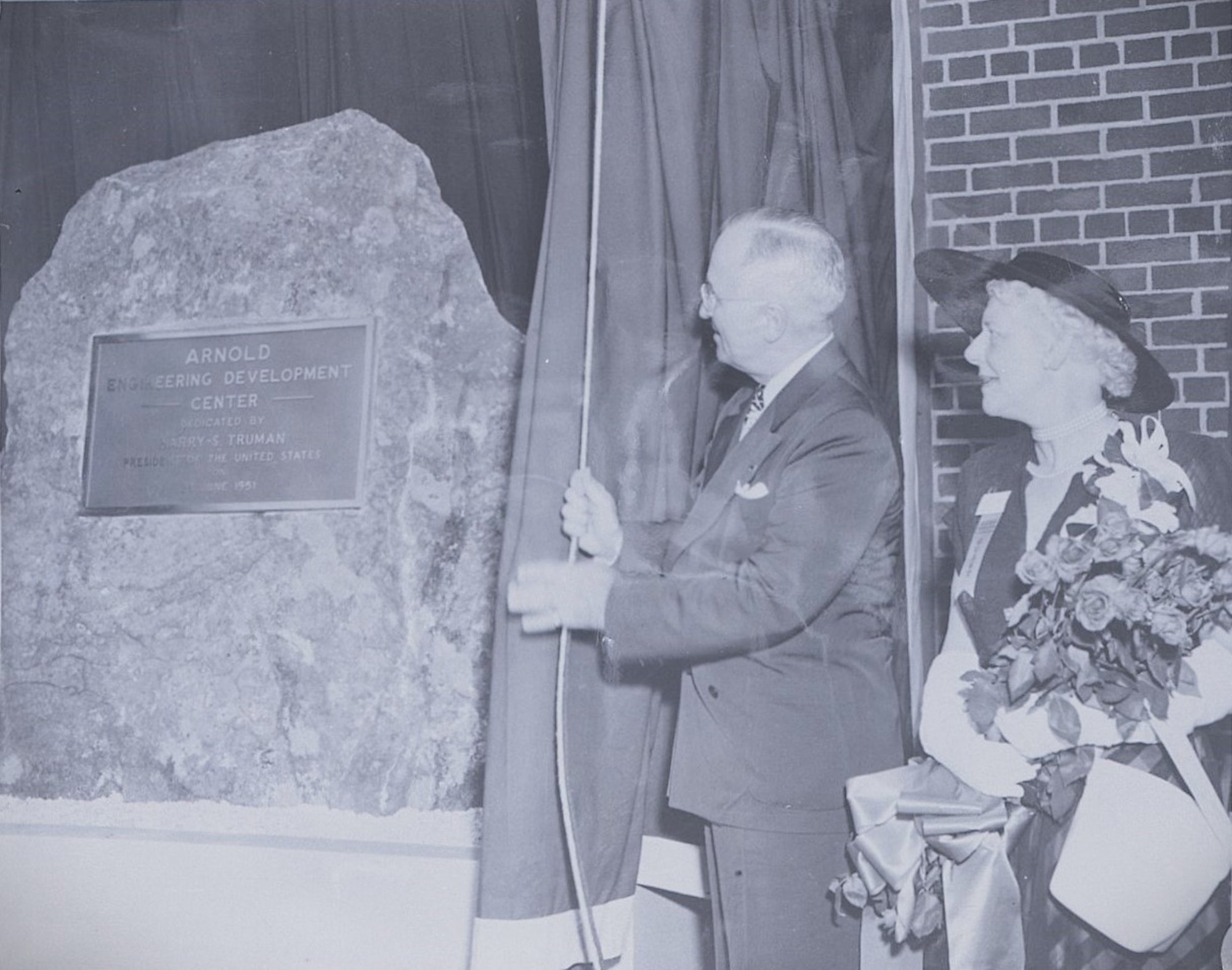 In 1951, President Harry S. Truman dedicated this boulder and placard for the establishment of Arnold Engineering Development Complex. Seventy-five years later, the commemorative boulder still stands as a centerpiece beneath the colors at Arnold Air Force Base, Tenn.