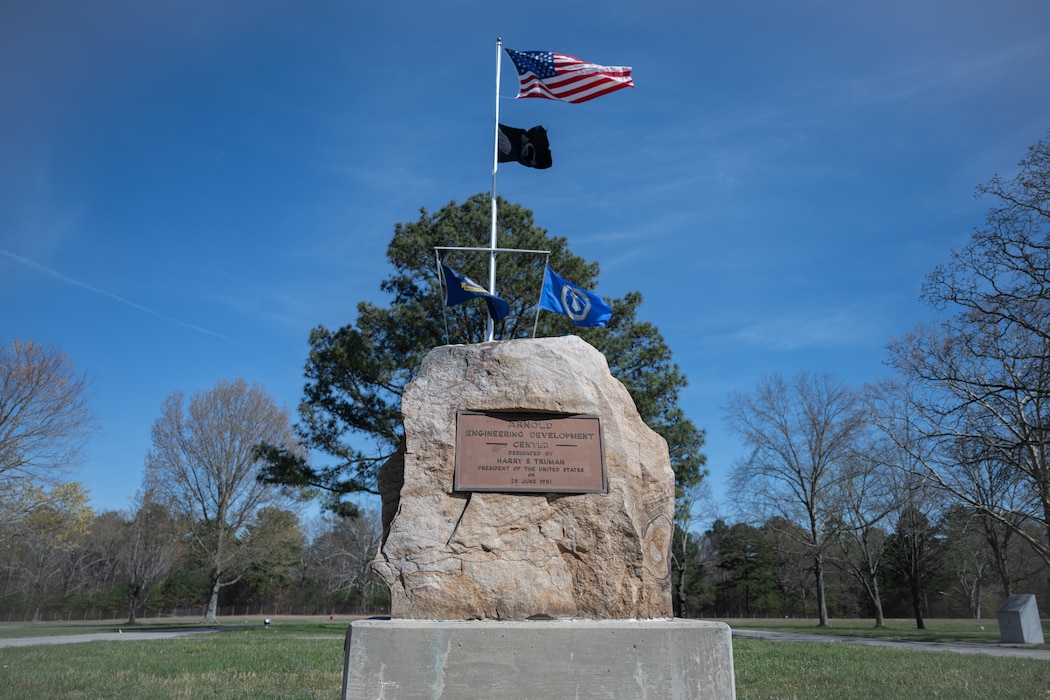 In 1951, President Harry S. Truman dedicated this boulder and placard for the establishment of Arnold Engineering Development Complex. Seventy-five years later, the commemorative boulder still stands as a centerpiece beneath the colors at Arnold Air Force Base, Tenn.