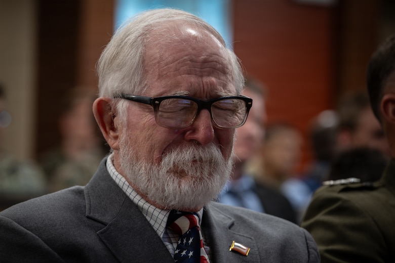 Allan McPherson, brother of the late Maj. Everette McPherson, attends a posthumous Distinguished Flying Cross ceremony honoring the heroic actions of his brother at Marine Support Facility New Orleans, March 18, 2026. The Distinguished Flying Cross is awarded to those who have displayed single acts of heroism or extraordinary achievement while participating in aerial flight. Maj. McPherson, a fighter jet pilot, posthumously received the award for sacrificing his life during the Vietnam War in an attempt to save the life of his co-pilot. (U.S. Marine Corps photo by Lance Cpl. Claire Cheney)