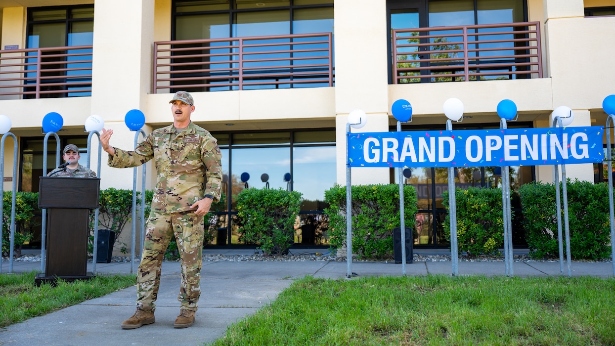 A commander gives remarks at a dorm grand opening
