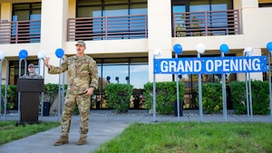 A commander gives remarks at a dorm grand opening