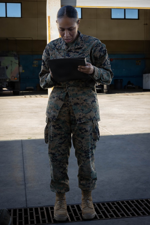 U.S. Marine Corps Lance Cpl. Angelique Skelton, a warehouse clerk with 4th Medical Battalion, 4th Marine Logistics Group, Marine Forces Reserve, takes down gear accountability information on a roster during a Reserve Mobilization Exercise 26, San Diego, March 3, 2026. The week-long exercise validates the battalion’s ability to rapidly activate personnel and equipment, ensuring the unit can deliver ready forces in response to a national crisis. (U.S. Marine Corps photo by Lance Cpl. Claire Cheney)