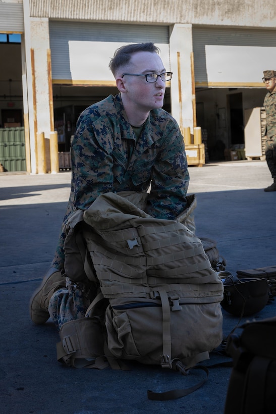 U.S. Marine Corps Lance Cpl. Justin Solomon, an administrative specialist with 4th Medical Battalion, 4th Marine Logistics Group, Marine Forces Reserve, packs his main pack during a Reserve Mobilization Exercise 26, San Diego, March 3, 2026. The week-long exercise validates the battalion’s ability to rapidly activate personnel and equipment, ensuring the unit can deliver ready forces in response to a national crisis. (U.S. Marine Corps photo by Lance Cpl. Claire Cheney)