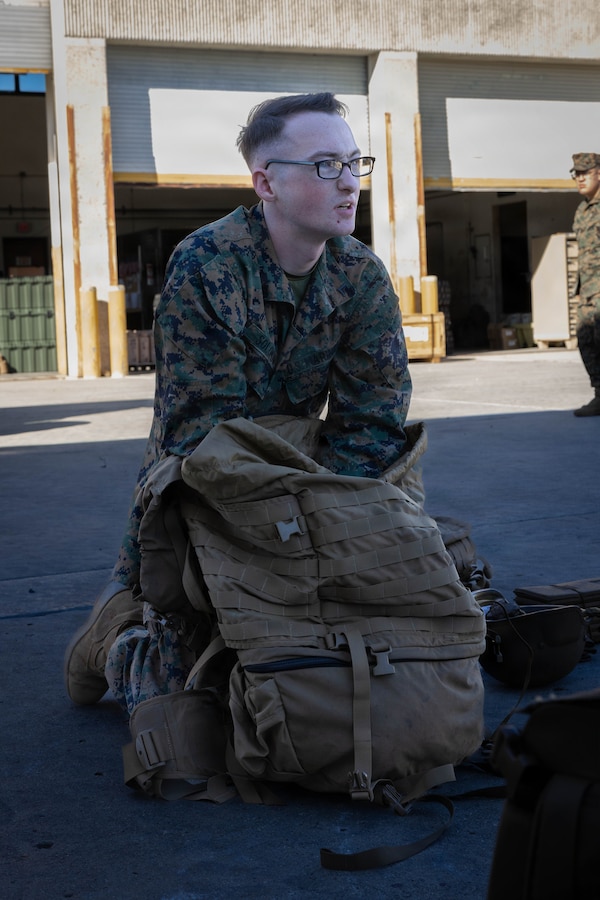 U.S. Marine Corps Lance Cpl. Justin Solomon, an administrative specialist with 4th Medical Battalion, 4th Marine Logistics Group, Marine Forces Reserve, packs his main pack during a Reserve Mobilization Exercise 26, San Diego, March 3, 2026. The week-long exercise validates the battalion’s ability to rapidly activate personnel and equipment, ensuring the unit can deliver ready forces in response to a national crisis. (U.S. Marine Corps photo by Lance Cpl. Claire Cheney)