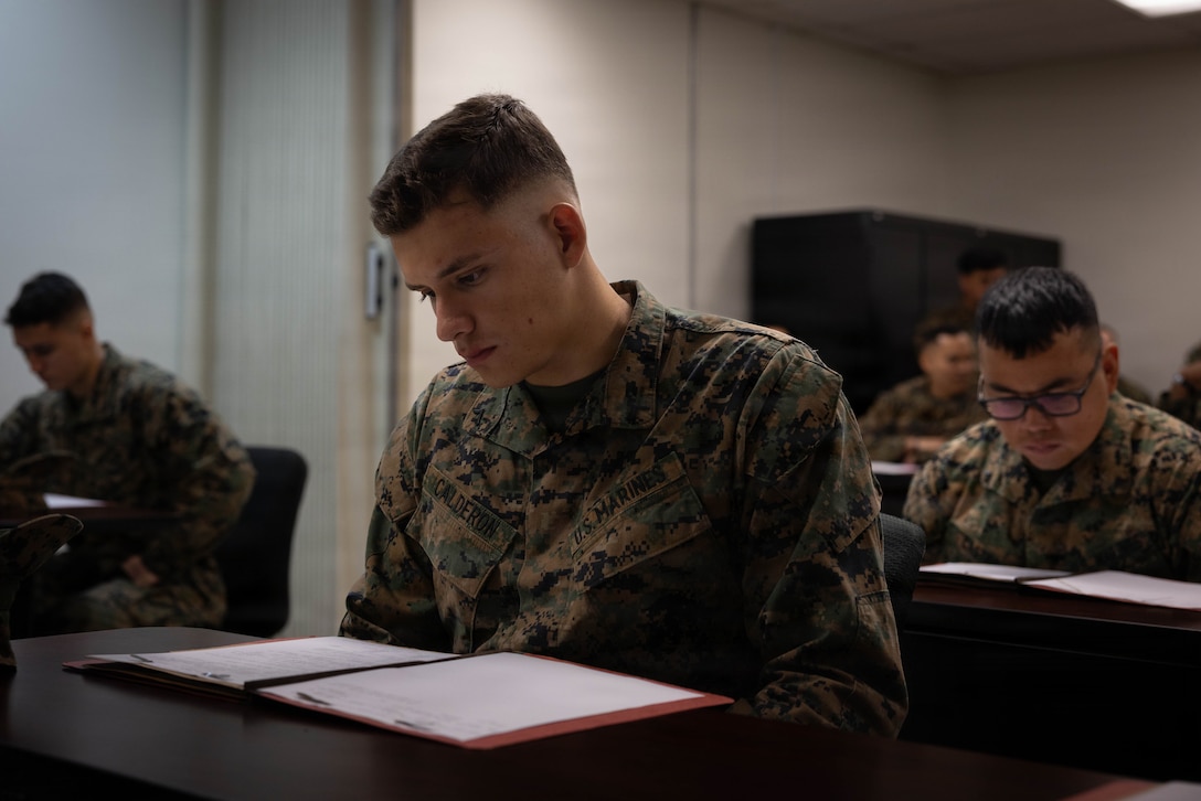 U.S. Marine Corps Pfc. Juan Calderon, a motor vehicle operator with 4th Medical Battalion, 4th Marine Logistics Group, Marine Forces Reserve, checks his audit package for incorrect information during a Reserve Mobilization Exercise 26 (RMX-26), San Diego, March 3, 2026. The week-long exercise validates the battalion’s ability to rapidly activate personnel and equipment, ensuring the unit can deliver ready forces in response to a national crisis. (U.S. Marine Corps photo by Lance Cpl. Claire Cheney)