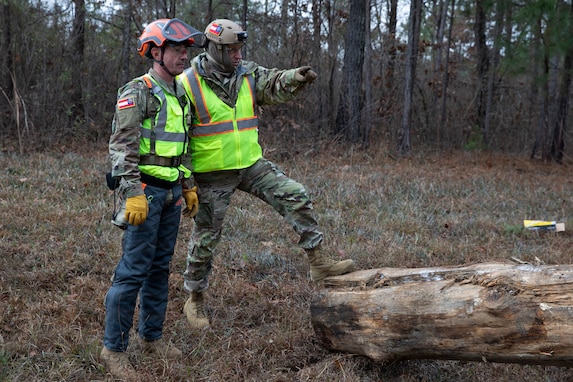 Georgia State Defense Force personnel assess a simulated obstacle during Vigilant Guard 26-1 at the Pelham Range Complex, Anniston, Alabama, Dec. 4, 2025. The Ga. Department of Defense conducts Vigilant Guard 26-1 to improve National Homeland Defense Readiness, by exercising the Ga. DoD Joint Forces Headquarters (JFHQ) to execute State/Territory Homeland Defense plans in a simulated environment, rehearse JFHQ interoperability with federal and civilian partners, in response to a complex, multi-domain attack. (U.S. Army National Guard photo by Sgt. Thomas Norris)