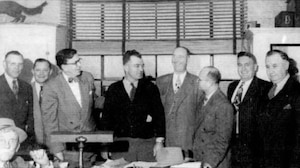 City of Tullahoma business and civic leaders celebrate Nov. 9, 1949, following the announcement that the former Camp Forrest Army training base near Tullahoma was selected as the site for the new Air Engineering Development Center, which would later become the headquarters of Arnold Engineering Development Complex. Pictured standing from left are T.A. Wiseman, then-Tullahoma Mayor Jack T. Farrar, John W. Harton, A.H. Sanders, F.I. Couser, Morris Simon, Erwin Coop and Floyd Mitchell. Pictured seated in the lower left is Hugh Ledford. (Courtesy photo)
