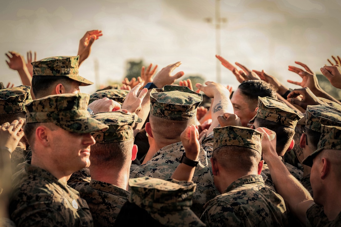 U.S. Marine Corps Sgt. Maj. Carlos A. Ruiz, the 20th Sergeant Major of the Marine Corps, calls Marines into a huddle at Marine Corps Support Facility New Orleans, March 10, 2026. Ruiz visited the facility as part of the SMMC Force Level Summit. (U.S. Marine Corps photo by Cpl. Van Hoang)