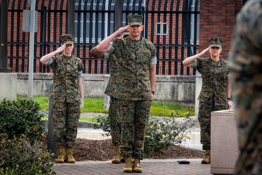 U.S. Marine Corps Sgt. Maj. Carlos A. Ruiz, the 20th Sergeant Major of the Marine Corps, and his staff salute for colors at Marine Corps Support Facility New Orleans, March 10, 2026. Ruiz visited the facility as part of the SMMC Force Level Summit. (U.S. Marine Corps photo by Lance Cpl. Edward Spears)