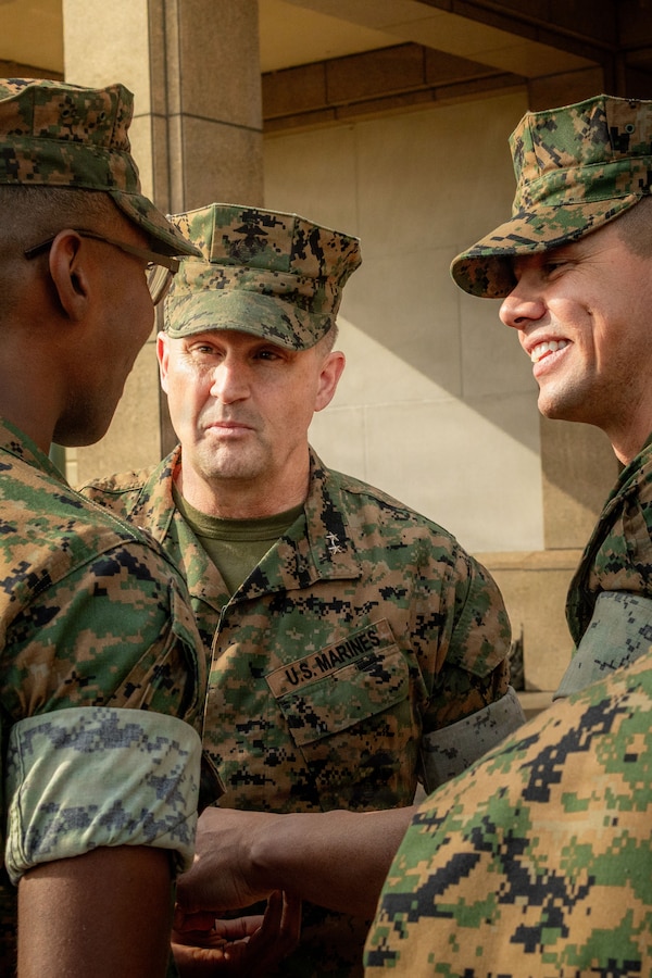 U.S. Marine Corps Sgt. Kenneth Johnson, left, a legal clerk with Headquarters Battalion, Marine Forces Reserve, stands at the position of attention at Marine Corps Support Facility New Orleans, March 10, 2026. Johnson was meritoriously promoted to the rank of sergeant by Sgt. Maj. Carlos A. Ruiz, the 20th Sergeant Major of the Marine Corps, and Maj. Gen. Douglas Clark, deputy commander of Marine Forces Reserve and Marine Corps Forces South. (U.S. Marine Corps photo by Lance  Cpl. Edward Spears)