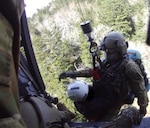 A Tennessee Army National Guard UH-60 Black Hawk hoists Sgt. 1st Class John Sharbel and a hiker in medical distress into the aircraft near False Gap Trail, a remote area of Great Smoky Mountains National Park, southeast of Gatlinburg near the North Carolina border, March 25, 2026. Courtesy photo.