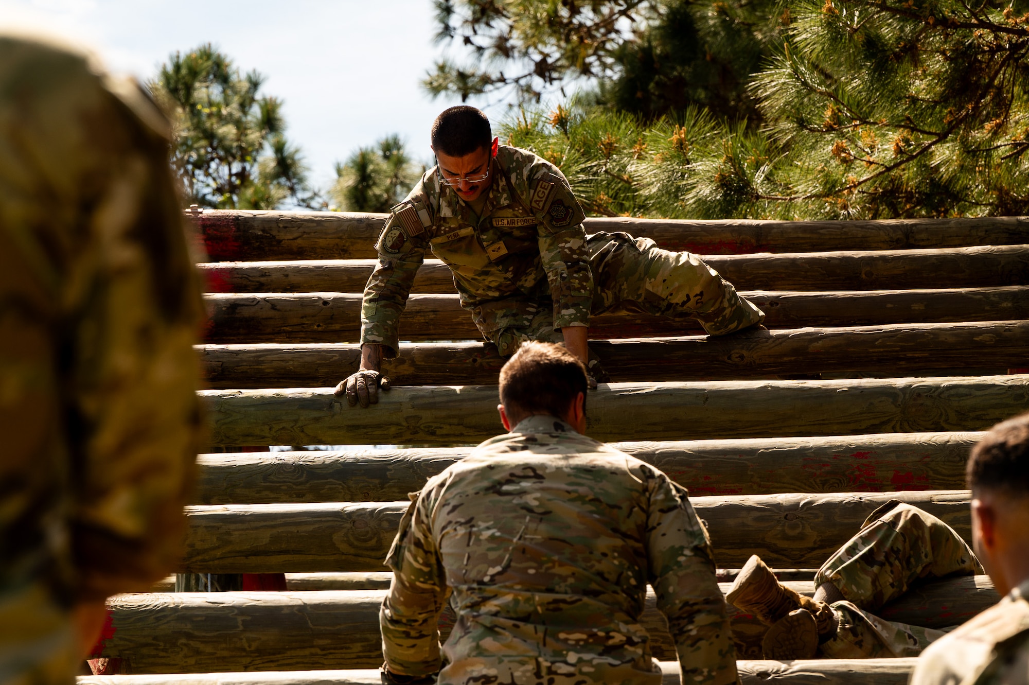 U.S. Air Force Senior Airman Adrian Pena, 437th Maintenance Group aerospace ground equipment specialist, participates in the weaver obstacle course during the Airman Leadership School field training exercise at the Marine Corps Recruiting Depot, Parris Island, South Carolina.