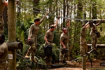 Airman Leadership School instructors participate in the endurance obstacle course during the ALS field training exercise at the Marine Corps Recruiting Depot, Parris Island, South Carolina.