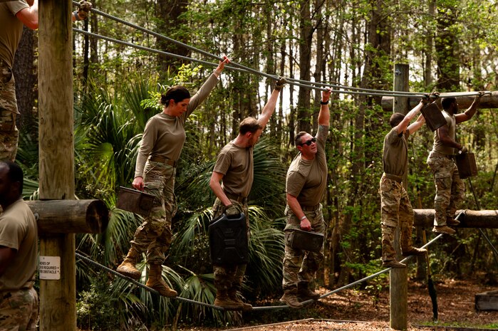 Airman Leadership School instructors participate in the endurance obstacle course during the ALS field training exercise at the Marine Corps Recruiting Depot, Parris Island, South Carolina.