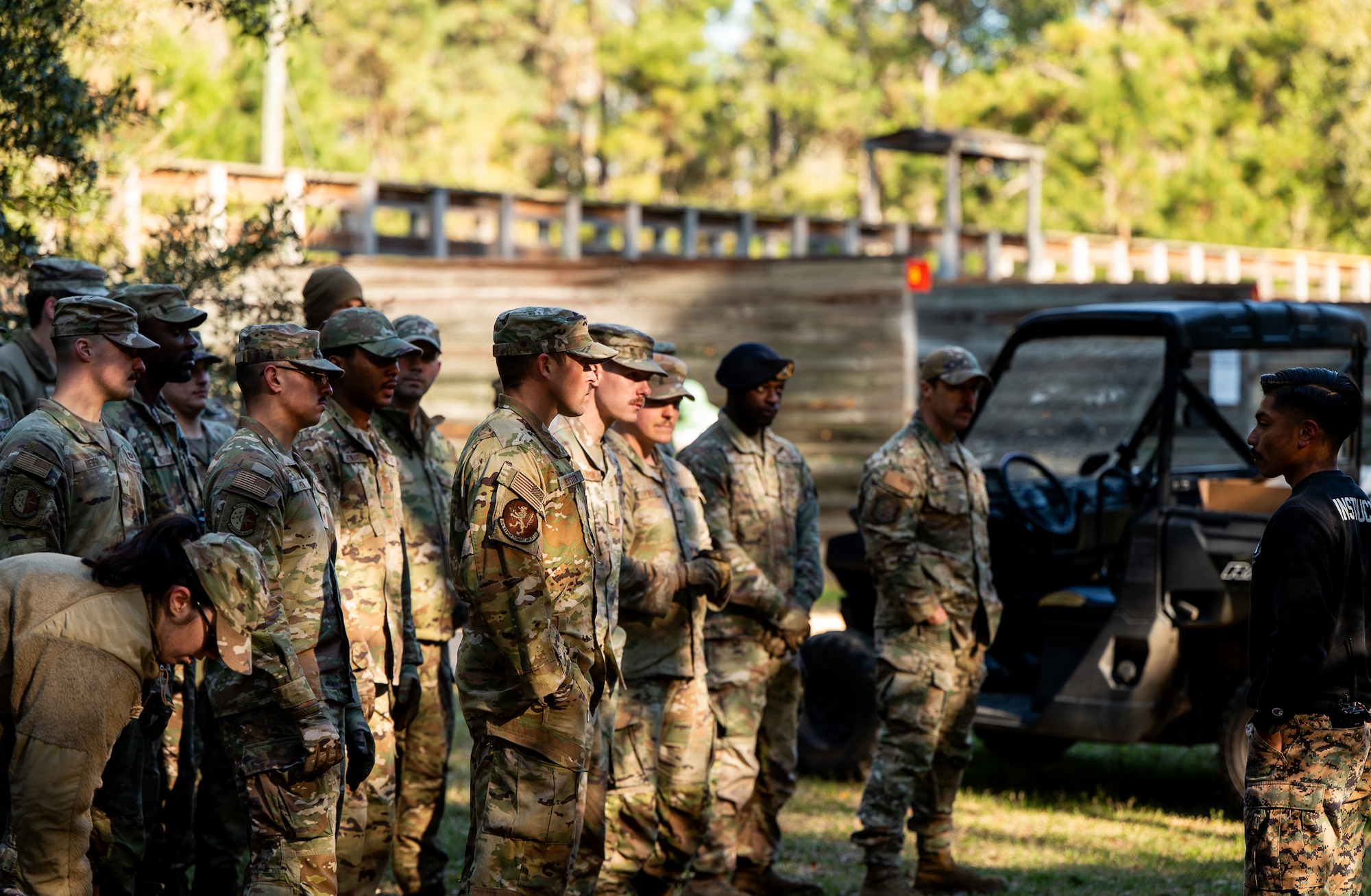U.S. Marine Corps Cpl. Johny Escamilla, Field Training Company weapons and Field Training Battalion warrior instructor, gives a pre-brief during a joint Airmen Leadership School field training exercise at the Marine Corps Recruiting Depot, Parris Island, South Carolina.