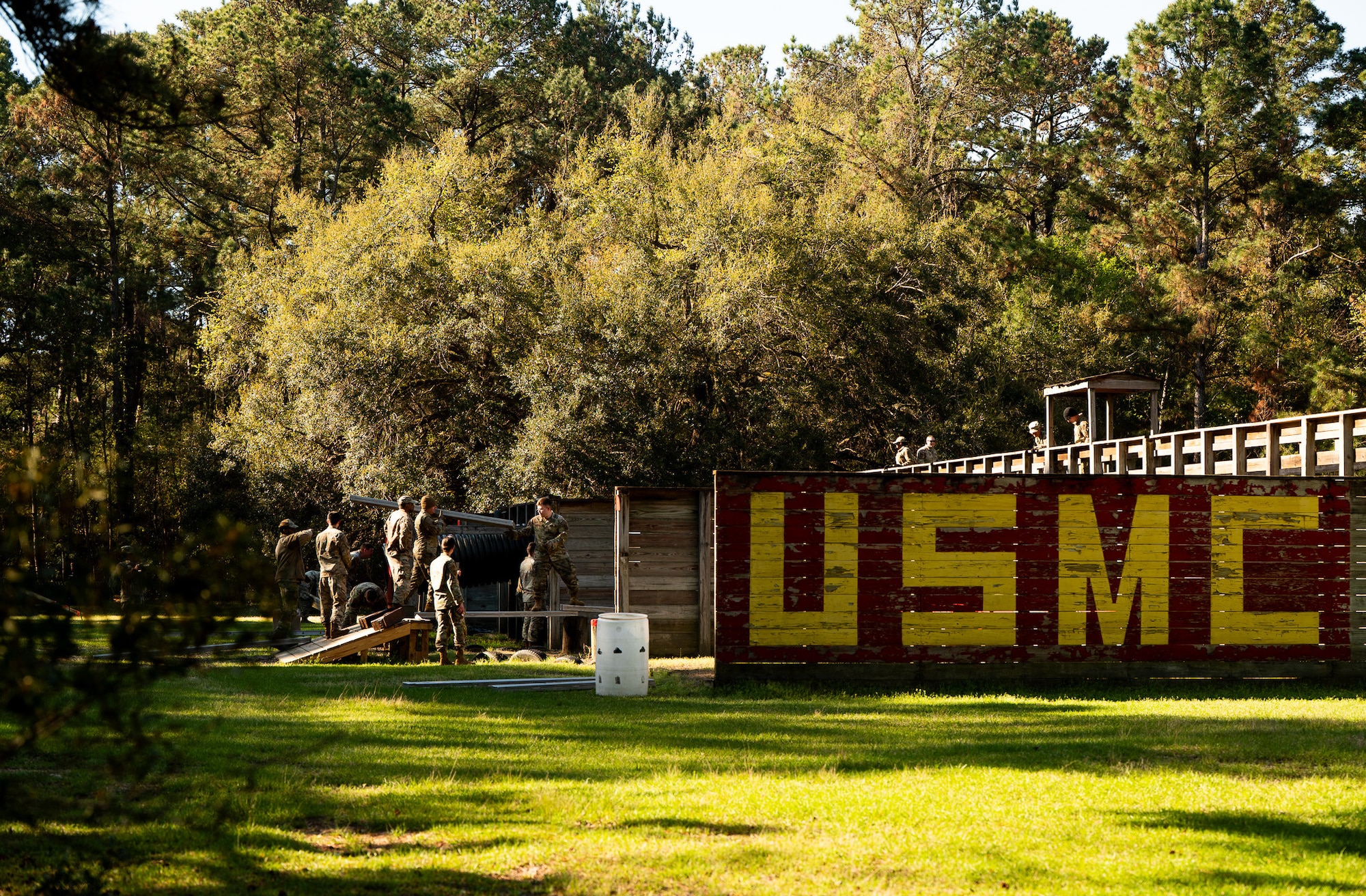 Airmen Leadership School Airmen and Coastguardsmen participate in obstacle courses under the supervision of instructors during an ALS field training exercise at the Marine Corps Recruiting Depot, Parris Island, South Carolina.