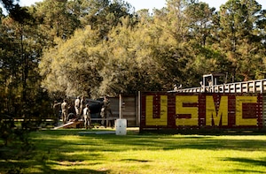 Airmen Leadership School Airmen and Coastguardsmen participate in obstacle courses under the supervision of instructors during an ALS field training exercise at the Marine Corps Recruiting Depot, Parris Island, South Carolina.