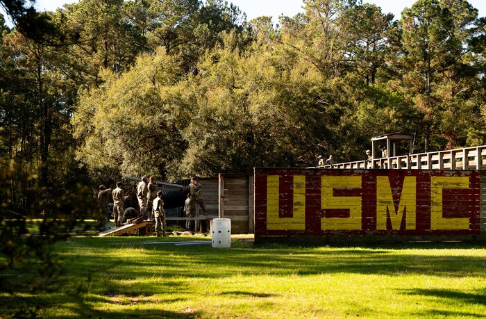 Airmen Leadership School Airmen and Coastguardsmen participate in obstacle courses under the supervision of instructors during an ALS field training exercise at the Marine Corps Recruiting Depot, Parris Island, South Carolina.