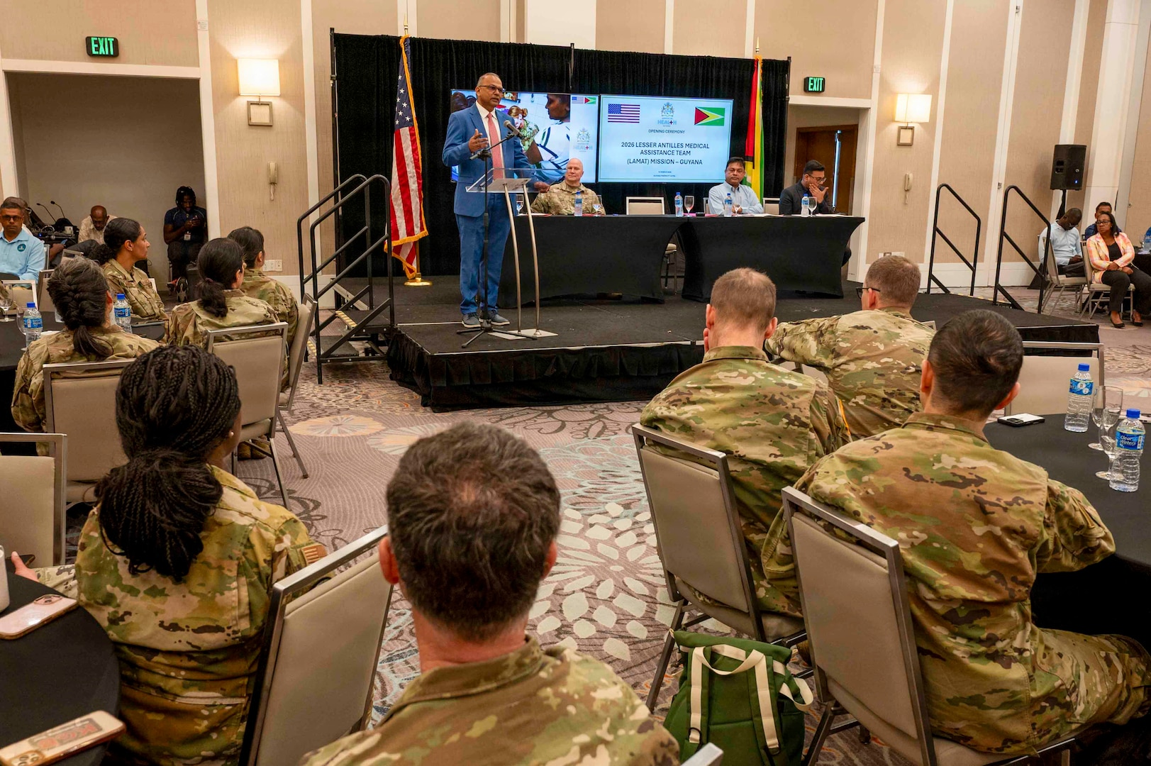 Dr. Anand Persaud, Ministry of Health of the Cooperative Republic of Guyana liaison to the Lesser Antilles Medical Assistance Team (LAMAT) mission, delivers remarks during the opening ceremony for LAMAT26 in Georgetown, Guyana, March 16, 2026. This collaboration reinforces the U.S. commitment to being a trusted partner in the Caribbean and Lesser Antilles region, while supporting shared security and well-being of the hemisphere. (U.S. Air Force photo by Maj. Stephani Schafer)