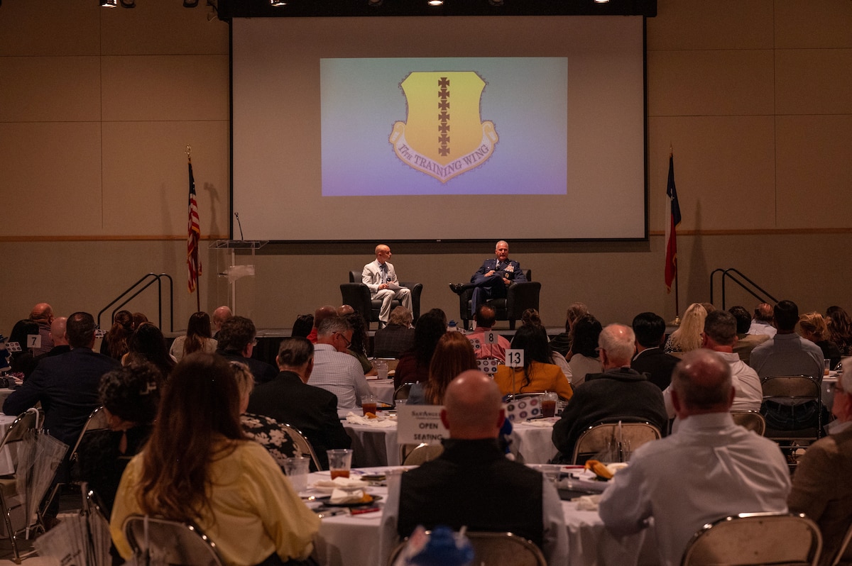 U.S. Air Force Col. Matthew Norton, 17th Training Wing commander and J.R. Orlando, 17 TRW public affairs chief, speak during the San Angelo Chamber of Commerce State of Goodfellow luncheon at the McNease Convention Center, San Angelo, Texas, March 24, 2026. The event brought together military and community leaders to discuss the installation’s impact and future direction. (U.S. Air Force photo by Senior Airman James Salellas)