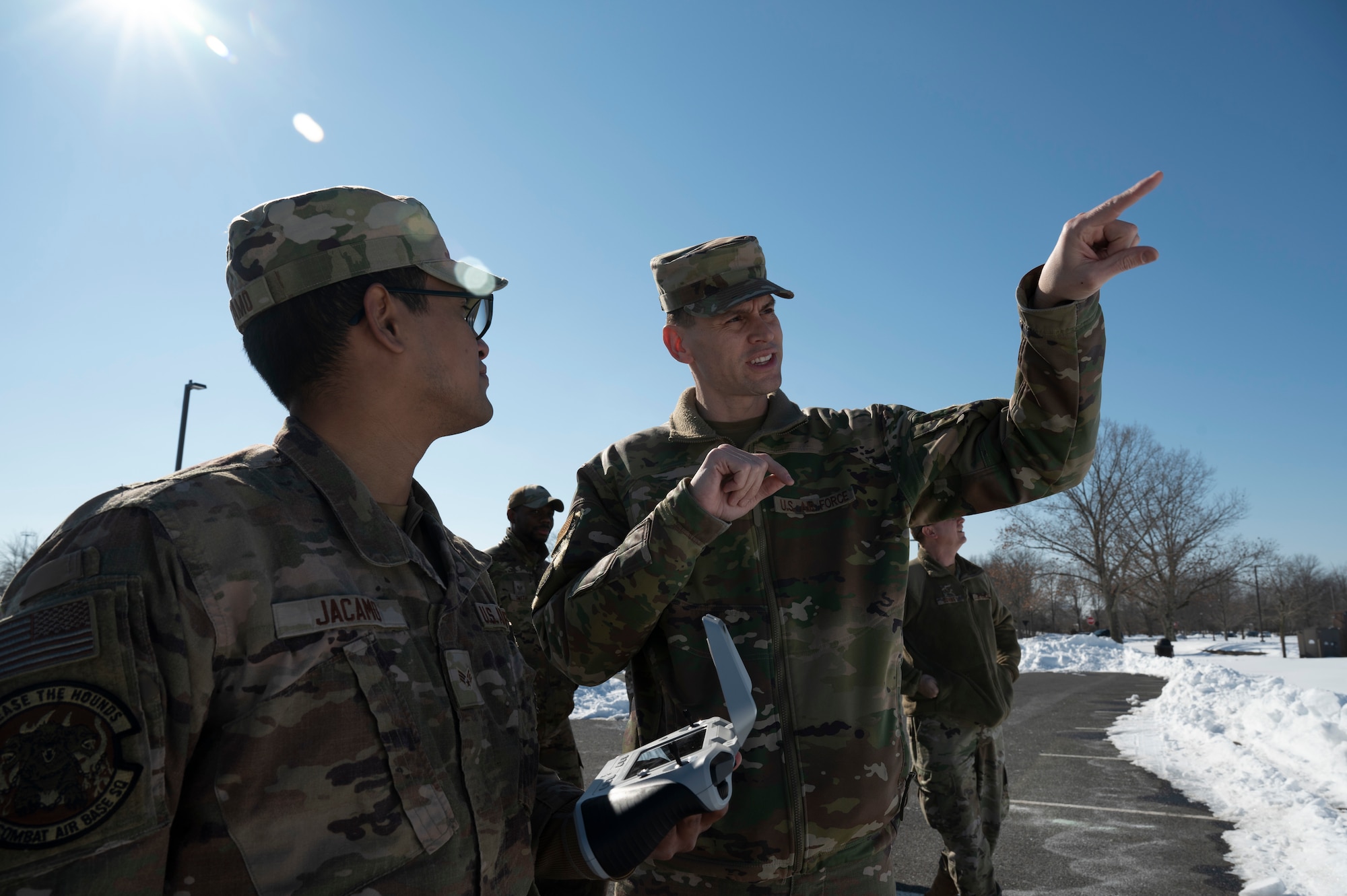 U.S. Air Force Master Sgt. Joshua Smith (right), 87th Air Base Wing small Unmanned Aircraft System (sUAS) program manager, instructs Senior Airman Jorge Jacamo, 723rd Combat Air Base Squadron electrical systems journeyman, during a sUAS course at Joint Base McGuire-Dix-Lakehurst, N.J., Feb. 4, 2026 .