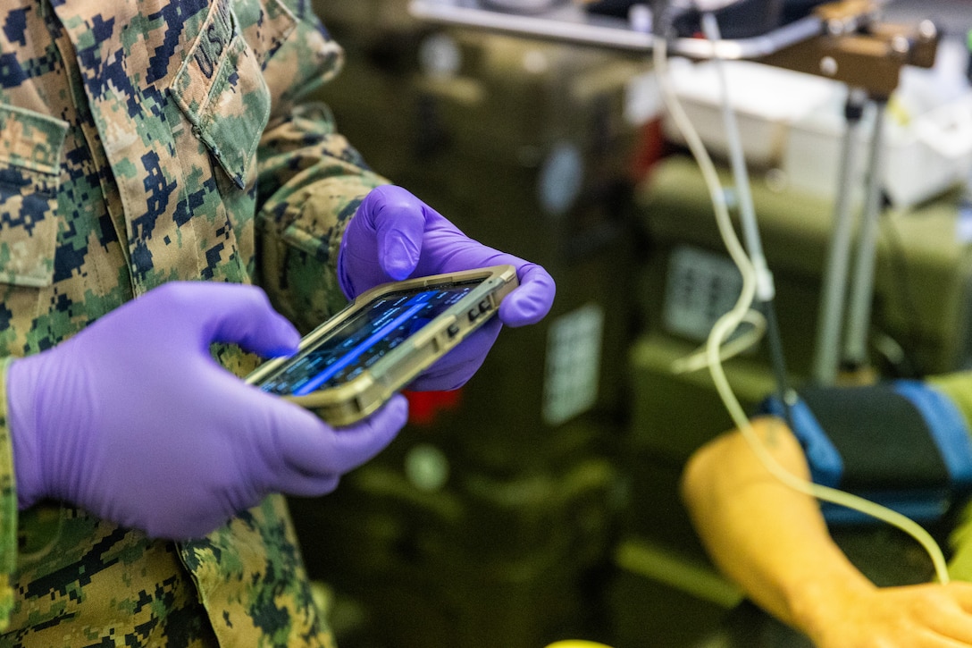 U.S. Navy Hospital Corpsman 3rd Class Nicky Fred Gikoro, with 2nd Battalion, 6th Marine Regiment, 2nd Marine Division, records patient data on a Battlefield Assisted Trauma Distributed Observation Kit-Joint during a Marine Corps Warfighting Laboratory-led mass casualty drill as part of exercise Cold Response 26 in Setermoen, Norway, March 11, 2026. The training allowed corpsmen to test new equipment designed to enhance patient data collection and improve medical evacuation networks in austere environments. A key component of NATO's enhanced vigilance activity Arctic Sentry, exercise Cold Response 26 is a Norwegian-led winter military exercise designed to enhance collective defense capabilities and ensure U.S. readiness to rapidly deploy and seamlessly operate alongside NATO Allies in challenging arctic conditions. (U.S. Marine Corps photo by Cpl. Michael Bartman)