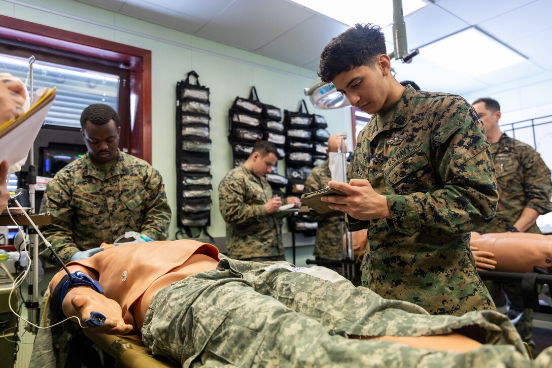 U.S. Navy Hospital Corpsman 3rd Class Joseph Dominguez, with 2nd Battalion, 6th Marine Regiment, 2nd Marine Division, uses a Battlefield Assisted Trauma Distributed Observation Kit-Joint to document simulated patient care during a Marine Corps Warfighting Laboratory-led mass casualty drill as part of exercise Cold Response 26 in Setermoen, Norway, March 11, 2026. The training allowed corpsmen to test new equipment designed to enhance patient data collection and improve medical evacuation networks in austere environments. A key component of NATO's enhanced vigilance activity Arctic Sentry, exercise Cold Response 26 is a Norwegian-led winter military exercise designed to enhance collective defense capabilities and ensure U.S. readiness to rapidly deploy and seamlessly operate alongside NATO Allies in challenging arctic conditions. (U.S. Marine Corps photo by Cpl. Michael Bartman)