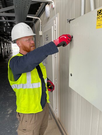 A Task Force SAFE electrician unlocks a panel to conduct an inspection at Tower 22 (Rukban), a small logistics base in northeastern Jordan near the Syria-Iraq border.