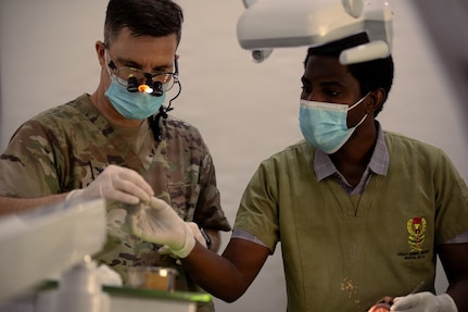 U.S. Air Force Maj. Daniel Cybulski, an infectious disease physician with the Center for Sustainment of Trauma and Readiness Skills Omaha, U.S. Air Force School of Aerospace Medicine, consults with Tanzania People’s Defence Force medical personnel during patient consultations as part of a medical readiness exercise during Justified Accord 2026 at Msata Military Training Base in Msata, Tanzania, March 9, 2026.