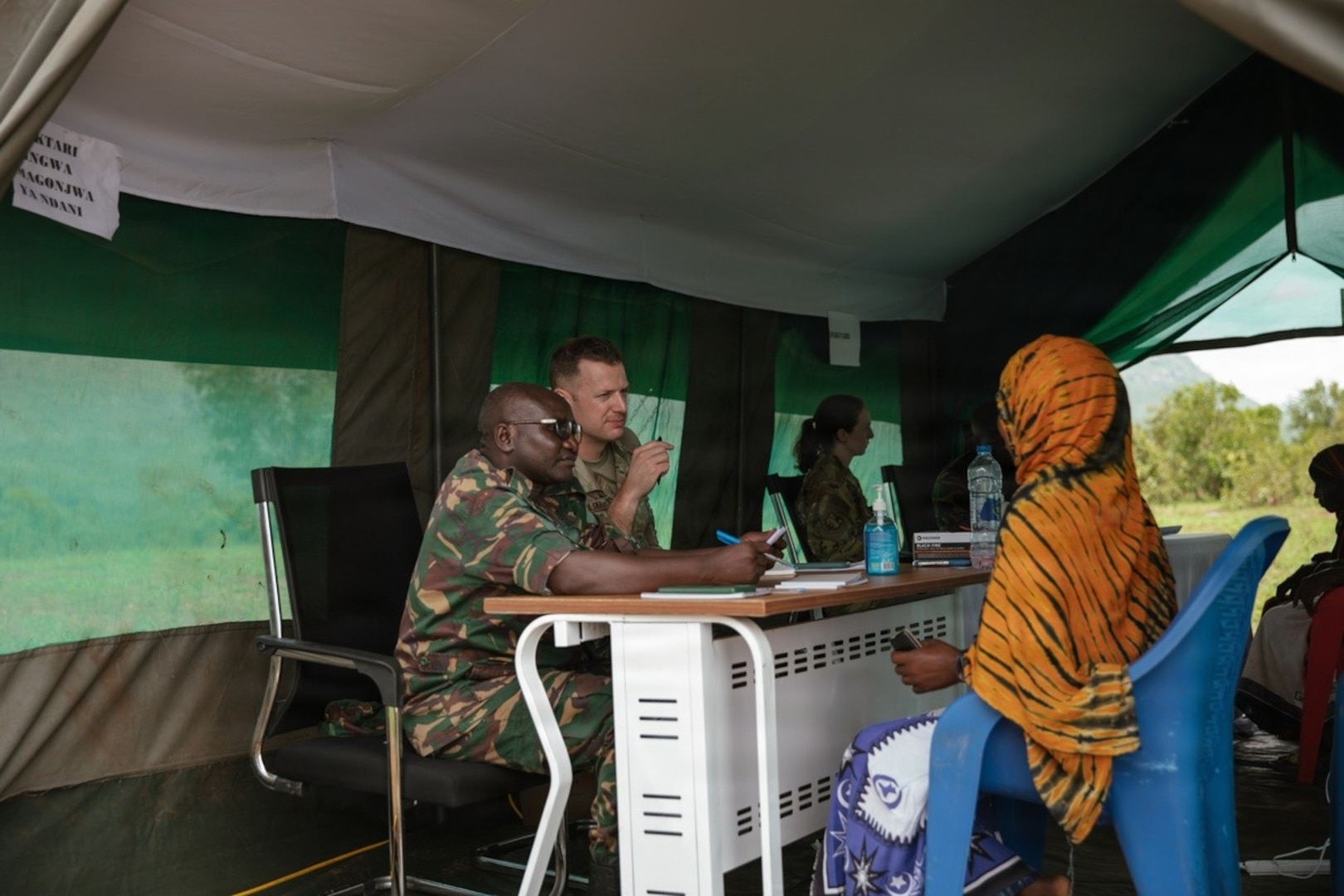 U.S. Air Force Maj. Daniel Cybulski, an infectious disease physician with the Center for Sustainment of Trauma and Readiness Skills Omaha, U.S. Air Force School of Aerospace Medicine, consults with Tanzania People’s Defence Force medical personnel during patient consultations as part of a medical readiness exercise during Justified Accord 2026 at Msata Military Training Base in Msata, Tanzania, March 9, 2026.