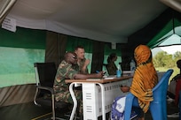 U.S. Air Force Maj. Daniel Cybulski, an infectious disease physician with the Center for Sustainment of Trauma and Readiness Skills Omaha, U.S. Air Force School of Aerospace Medicine, consults with Tanzania People’s Defence Force medical personnel during patient consultations as part of a medical readiness exercise during Justified Accord 2026 at Msata Military Training Base in Msata, Tanzania, March 9, 2026.