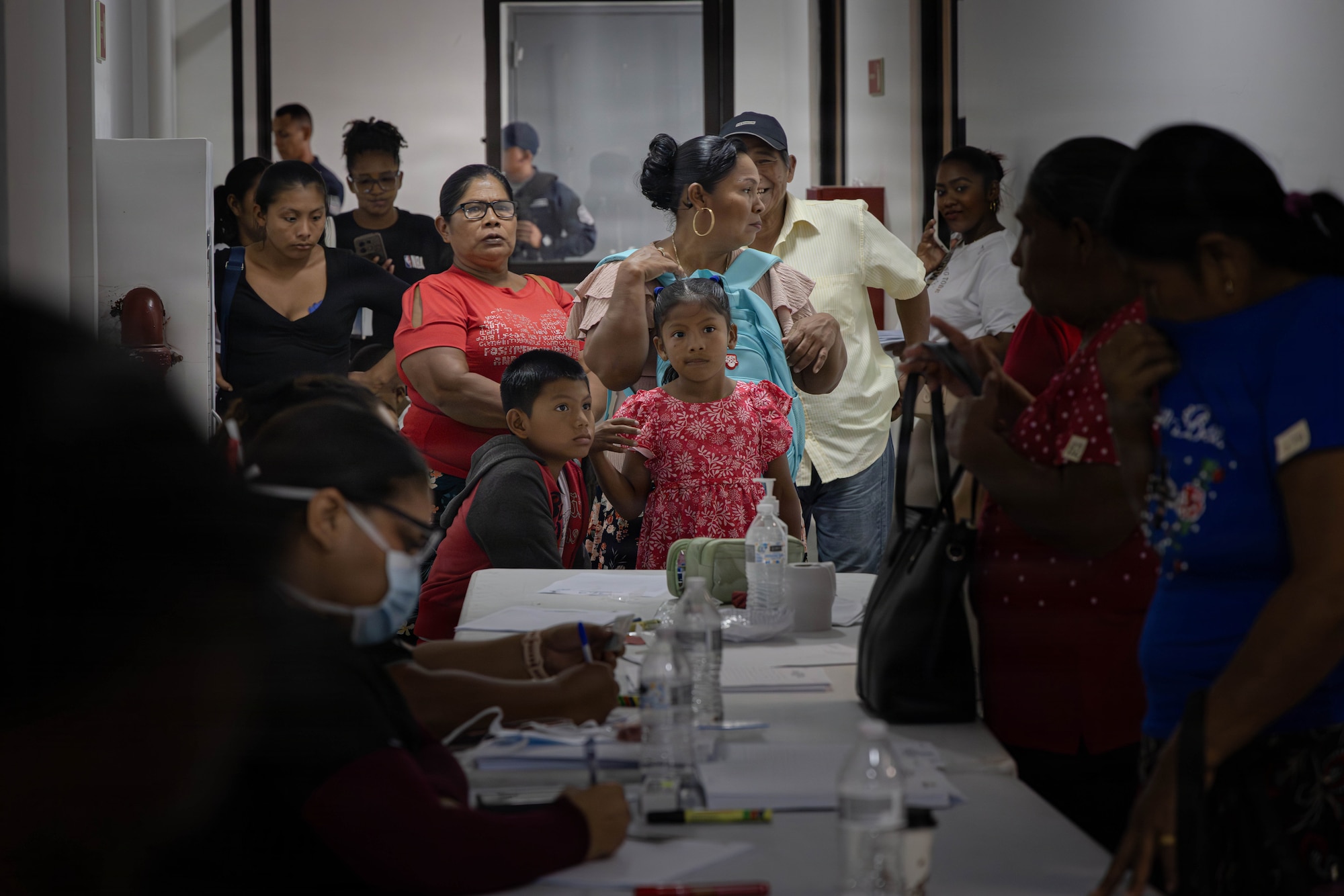 People varying in ages gather in a hospital.