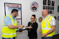 George Romero, 502d Force Support Group operations specialist, provides an exercise scenario to Melissa Gomez, 802d Military and Family Readiness supervisor, while Sean Yoder, Military and Family Readiness coordinator, observes at the Military and Family Readiness Center, Joint Base San Antonio-Lackland, Texas, March 24, 2026.