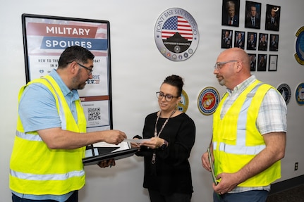 George Romero, 502d Force Support Group operations specialist, provides an exercise scenario to Melissa Gomez, 802d Military and Family Readiness supervisor, while Sean Yoder, Military and Family Readiness coordinator, observes at the Military and Family Readiness Center, Joint Base San Antonio-Lackland, Texas, March 24, 2026.