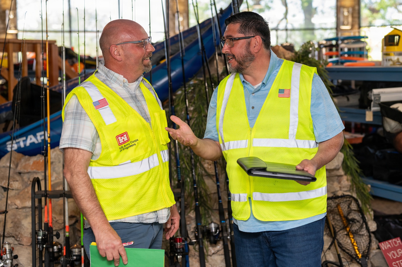 Sean Yoder, left, Family Readiness coordinator, and George Romero, 502d Force Support Group operations specialist, discuss exercise procedures during an Emergency Resilience Readiness Exercise at Joint Base San Antonio-Lackland, Texas, March 24, 2026. JBSA conducted a preplanned exercise March 24–27 to ensure personnel are prepared to respond to a potential severe weather event and widespread power outage. (U.S. Air Force photo by Marcus Robins)