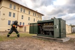 A CPS Energy technician shuts down power to an office building for the exercise at Joint Base San Antonio-Fort Sam Houston on March 26, 2026. The power outage exercise was to help JBSA installations prepare for real-word scenarios. (U.S. Air Force photo by Melissa Hydrick)
