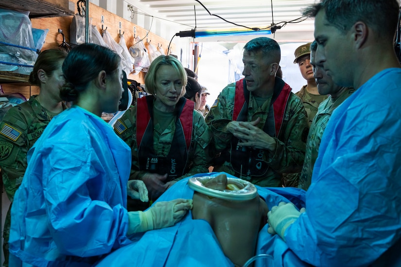 U.S. Army Lt. Gen. Mary K. Izaguirre, center-left, the U.S. Army Surgeon General, observes an External Evaluation and demonstration of littoral medical operations with Soldiers assigned to the 8th Forward Resuscitative Surgical Detachment aboard the U.S. Army Vessel SSG Elroy F. Wells (MSV(L)-01) at Joint Base Pearl Harbor-Hickam, Hawaii, March 24, 2026.