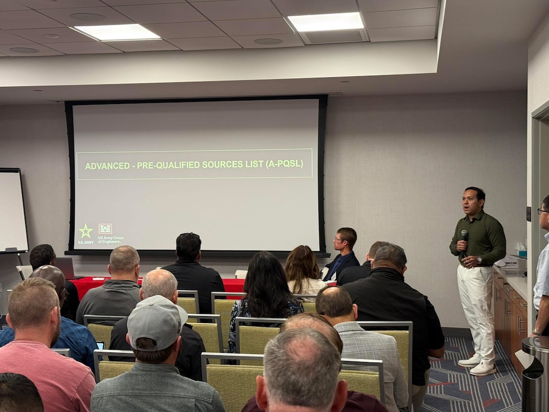 Sean Sackett, chief of the U.S. Army Corps of Engineers Los Angeles District Contracting Division, right, speaks to contractors March 5 during an Industry Day in Las Vegas highlighting upcoming project opportunities at Nellis Air Force Base, Nevada.