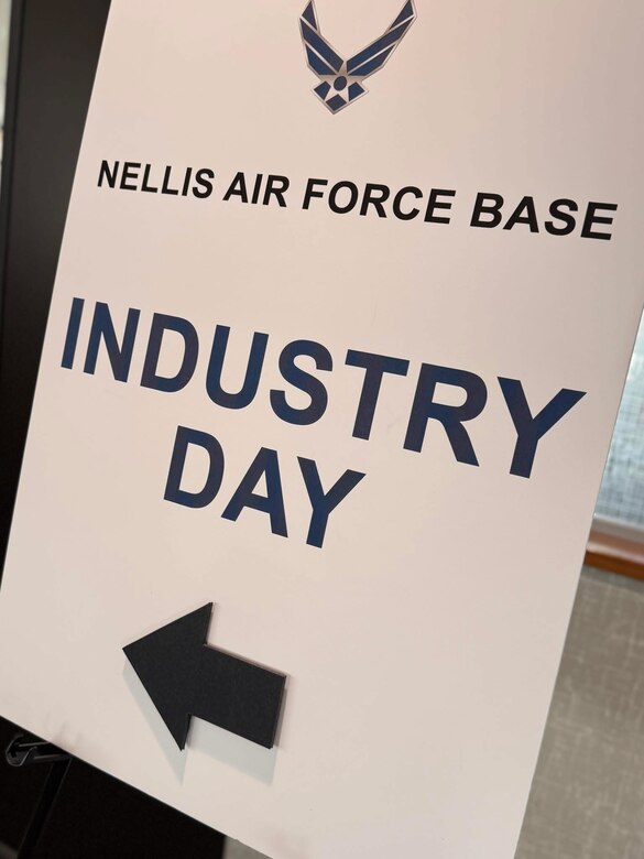 A sign directs attendees to an Industry Day hosted by the U.S. Army Corps of Engineers Los Angeles District focused on upcoming projects at Nellis Air Force Base.