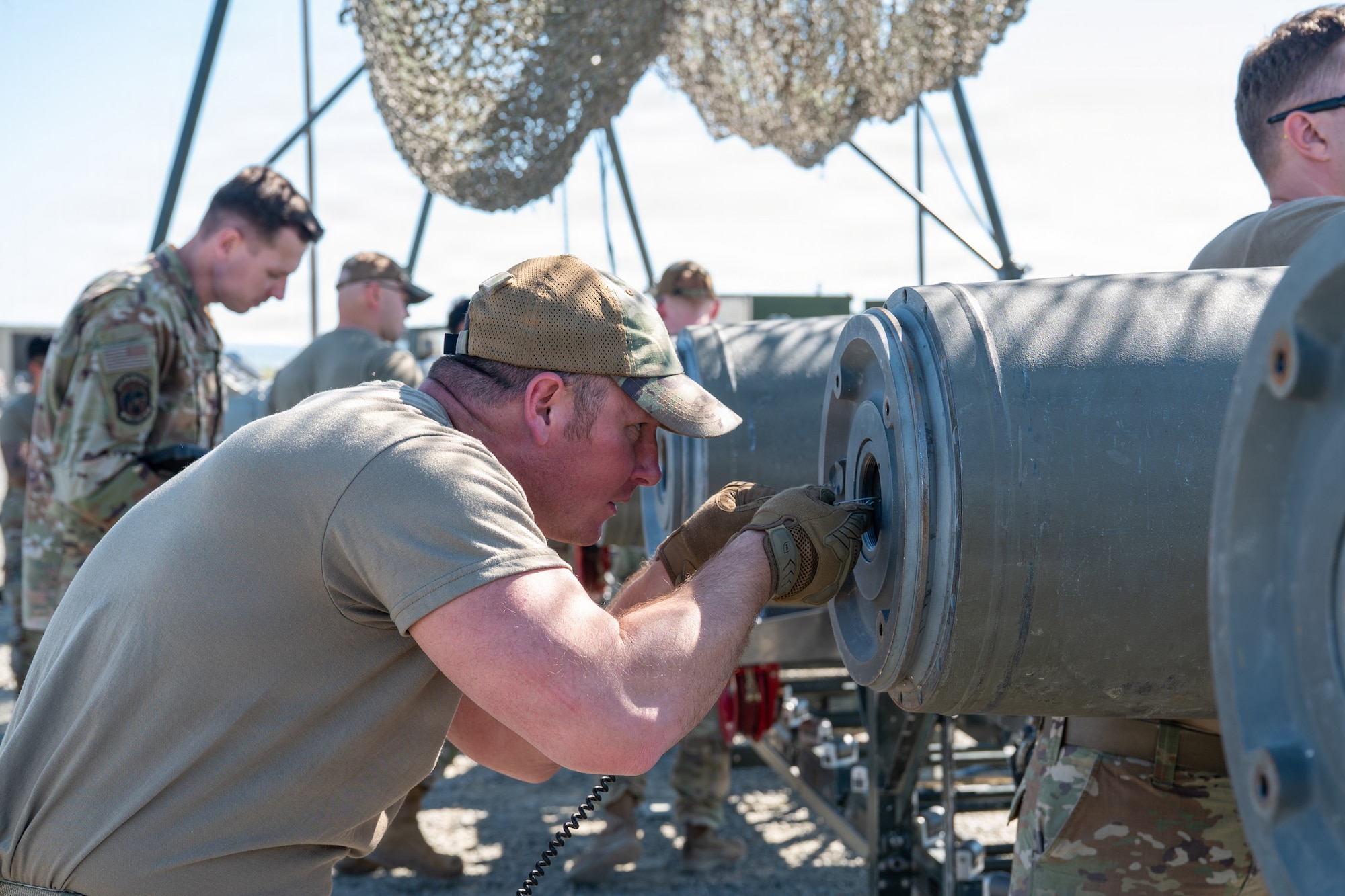 Airmen assembled live munitions to meet 24-hour sortie requirements while testing planning, assembly and movement skills. With its first class held in 1986, AFCOMAC celebrated its 40th anniversary with the graduation of class 2026-004. (U.S. Air Force photo by Airman 1st Class Ty'Jaih Wallace)