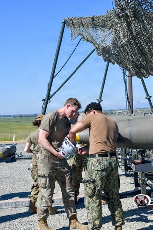 Airmen and Marines prepared live munitions to support 24-hour sortie requirements while strengthening mission-critical skills. With its first class held in 1986, AFCOMAC celebrated its 40th anniversary with the graduation of class 2026-004. (U.S. Air Force photo by 1st Lt. Sharon Kinghorn)